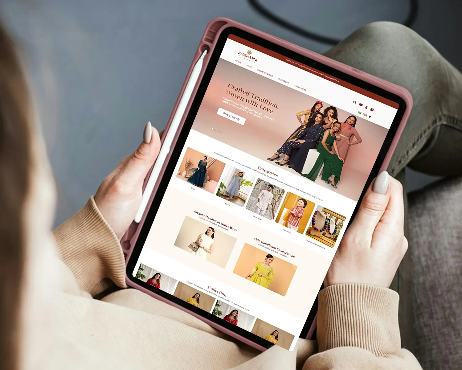 A woman browsing the Saubhari eCommerce fashion website on a tablet, showcasing elegant ethnic wear and modern collections — a Thinkster-designed online store emphasizing UX, responsiveness, and visual storytelling.